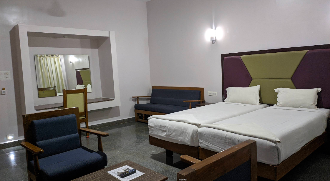 Executive suite interior at Kanthi Resorts luxury resort in Badami